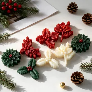Detailed macro shot of festive holly leaf and berry wax items made with silicone molds