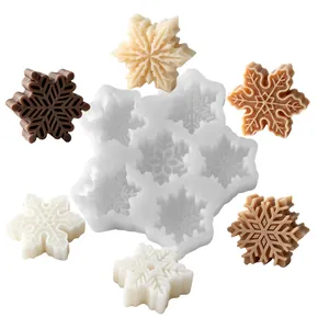 Snowflake silicone mold for candle making with 6 cavities on a white background