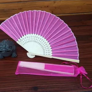 Traditional Chinese style magenta silk folding fan with a matching sheer organza drawstring bag