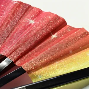 Macro detail of rainbow glitter powder texture on a 33cm folding Kung Fu fan