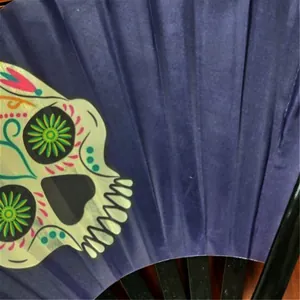 Close-up detail of a 33cm Kung Fu folding fan featuring a colorful sugar skull print