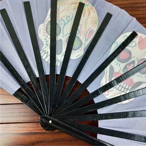 Detailed view of 33cm Kung Fu folding fan featuring colorful skull patterns on purple fabric