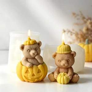 Cute Halloween bear candles with pumpkin hat and jack-o-lantern motifs for DIY decor