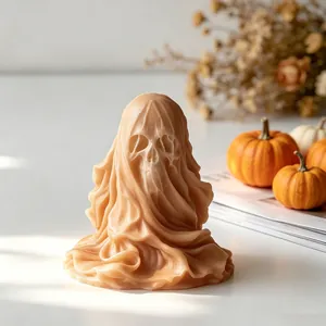 Detailed view of a veiled skull candle with intricate wax folds for Halloween.