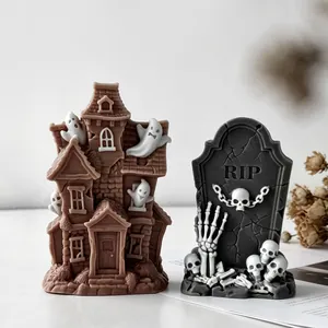 Detailed view of Halloween haunted house and RIP tombstone candle decorations