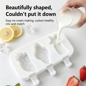 Detail view of silicone popsicle mold featuring rainbow, planet, and shooting star shapes