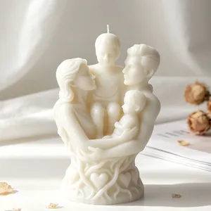 Intricate detail of family of four portrait sculpture candle with warm white finish