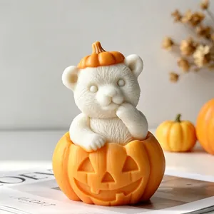 Exquisite detail of a cute white bear in a Jack-o'-lantern pumpkin candle mold