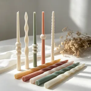 Macro detail of colorful spiral and wavy taper candles for home decor and aromatherapy