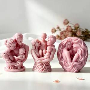 Close-up of pink family-themed scented candles with intricate sculptural details.