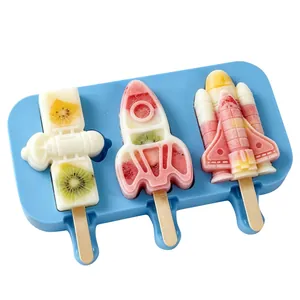 Space-themed silicone popsicle mold featuring rocket and shuttle shapes with fruit pops