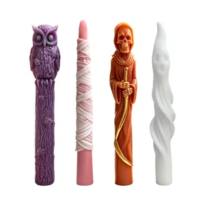 Detail of Halloween long candles featuring owl, mummy, grim reaper, and ghost designs