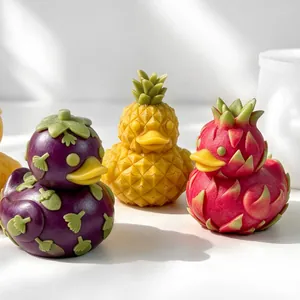 Close-up of fruit-shaped duck candles featuring pineapple, dragon fruit textures