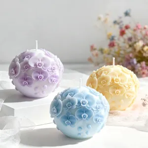 Exquisite orchid flower sphere scented candles in pastel purple, blue, and yellow