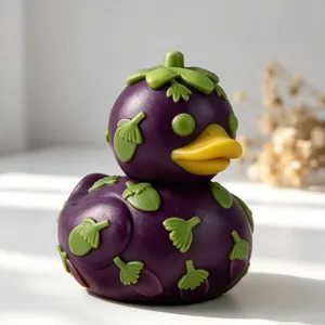 Close-up detail of a creative eggplant-themed fruit duck candle made from silicone mold