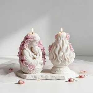 Detailed front and back view of mother and baby sculpted candle with pink floral accents.