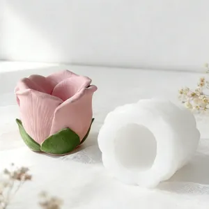 Close-up of DIY rose candle holder silicone mold and pink floral craft result