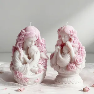 Detailed view of artistic mother and baby candles handcrafted using silicone art molds
