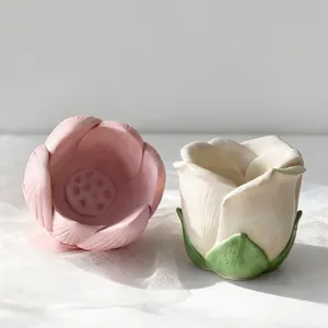Detailed view of pink and white lotus-shaped silicone molds for DIY candle making