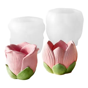 Detailed view of lotus and rose flower silicone molds with finished pink plaster crafts
