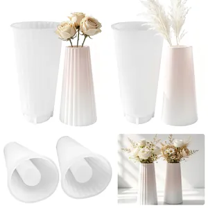 Detailed view of DIY silicone molds for resin and finished plaster flower vases