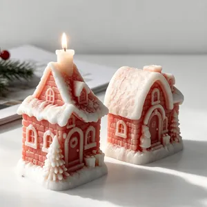 Macro detail of two pink snow house candles with intricate brick and snow textures