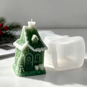 Detail view of silicone mold and finished green snowy house candle