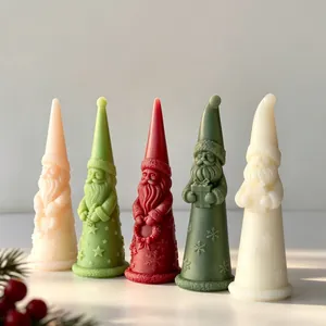 Detailed macro view of colorful Santa Claus shaped Christmas aromatherapy candles