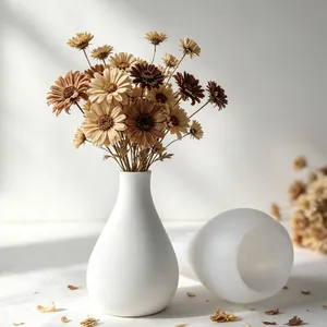 Detailed view of two elegant white matte vases created from a DIY silicone mold