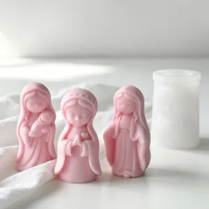 Detailed view of stylized pink Madonna figures made from silicone aromatherapy candle molds