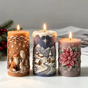 Intricate 3D relief Christmas candles featuring fox, winter village, and poinsettia designs