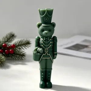 Detailed view of a green bear nutcracker soldier candle for festive Christmas DIY home decor
