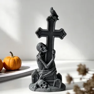 Close-up of a detailed Halloween skeleton and cross candle made from a DIY mold