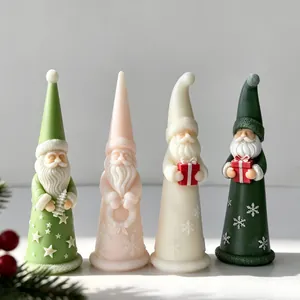 Detailed view of colorful Santa Claus shaped scented candles with festive decorations