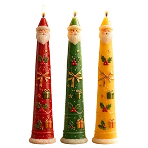 Three decorative Santa Claus cone candles in red green and yellow for Christmas home decor