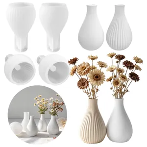 Detail showing striped and smooth silicone molds and finished vases with flowers