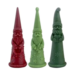 Decorative set of three Santa Claus Christmas candles in red and green festive colors