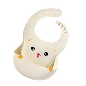 Cute cat-themed baby silicone bib with large food catcher pocket in cream white