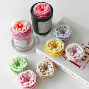 Handmade rose-shaped aromatherapy candles in various colors on a white background