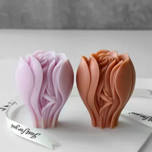 Abstract rose flower candle ornaments in purple and terracotta on white background