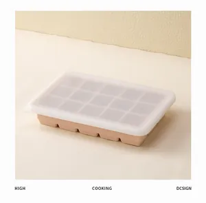 Detailed view of a peach silicone 15-compartment square ice cube tray with lid.