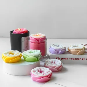 High-quality detailed view of colorful handmade rose shaped aromatherapy candles.