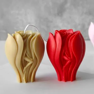 Detailed view of red and cream tulip-shaped decorative aromatherapy candles