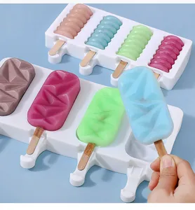 Detail view of white silicone popsicle molds with geometric and ridged shapes