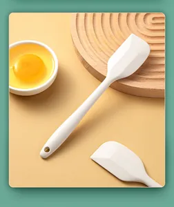 White food-grade silicone mini spatula for baby food prep and baking texture detail