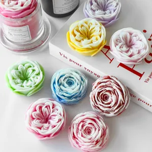 Detailed close-up showing texture of rose and peony flower shaped handmade candles