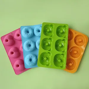 Various 6-cavity silicone baking molds in heart, star donut, and bear shapes for DIY