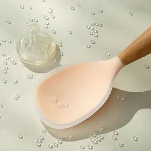 Food-grade silicone rice spoon with wooden handle and non-stick surface