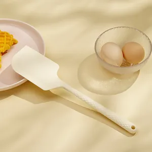 One-piece cream silicone spatula baking tool for cream scraping in a warm kitchen