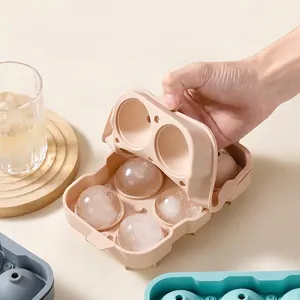 Round silicone ice ball mold for whiskey with top drainage holes for sphere ice cubes.
